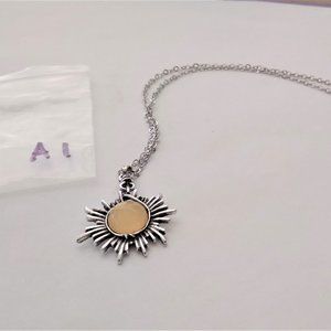 Silver tone sun fire with simulated citrine and 18 inch adjustable chain